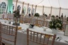 Photo of tables inside a marquee